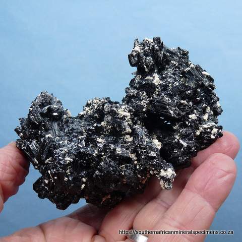 Excellent specimen of schorl crystals with hyalite opal and feldspar Excellent specimen of schorl crystals with hyalite opal and feldspar