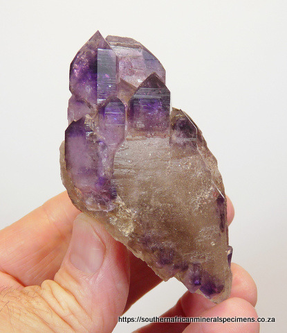 Amethyst / smoky quartz crystal group Amethyst / smoky quartz crystal group