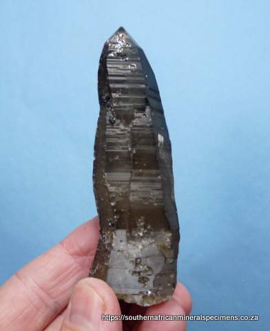 Smoky quartz crystal with cassiterite