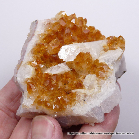 Geode lined with sparkling, milky quartz crystals