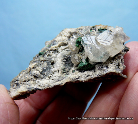 (?)Calcite crystals with bits of malachite, on matrix