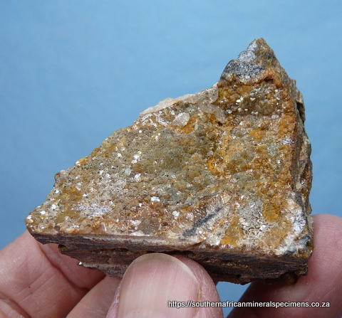Greenish smithsonite crystals on matrix with small cavities