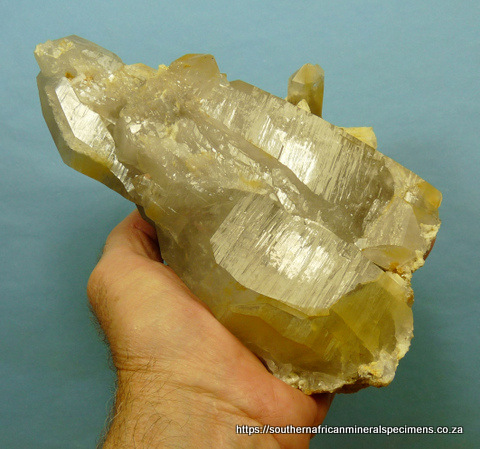 Quartz crystal group with feldspar and bits of rutile Quartz crystal group with feldspar and bits of rutile