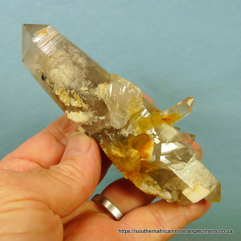 Double terminated quartz crystal with rutile, feldspa and dolomite Double terminated quartz crystal with rutile, feldspa and dolomite